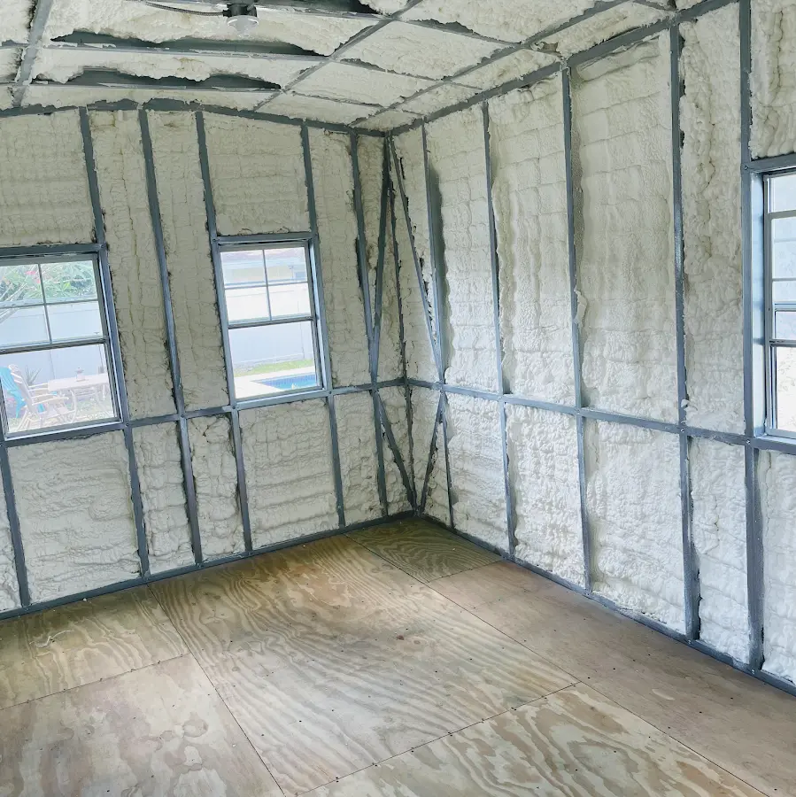 Closed-cell spray foam insulation applied to wall cavities in a residential project in Guttenberg